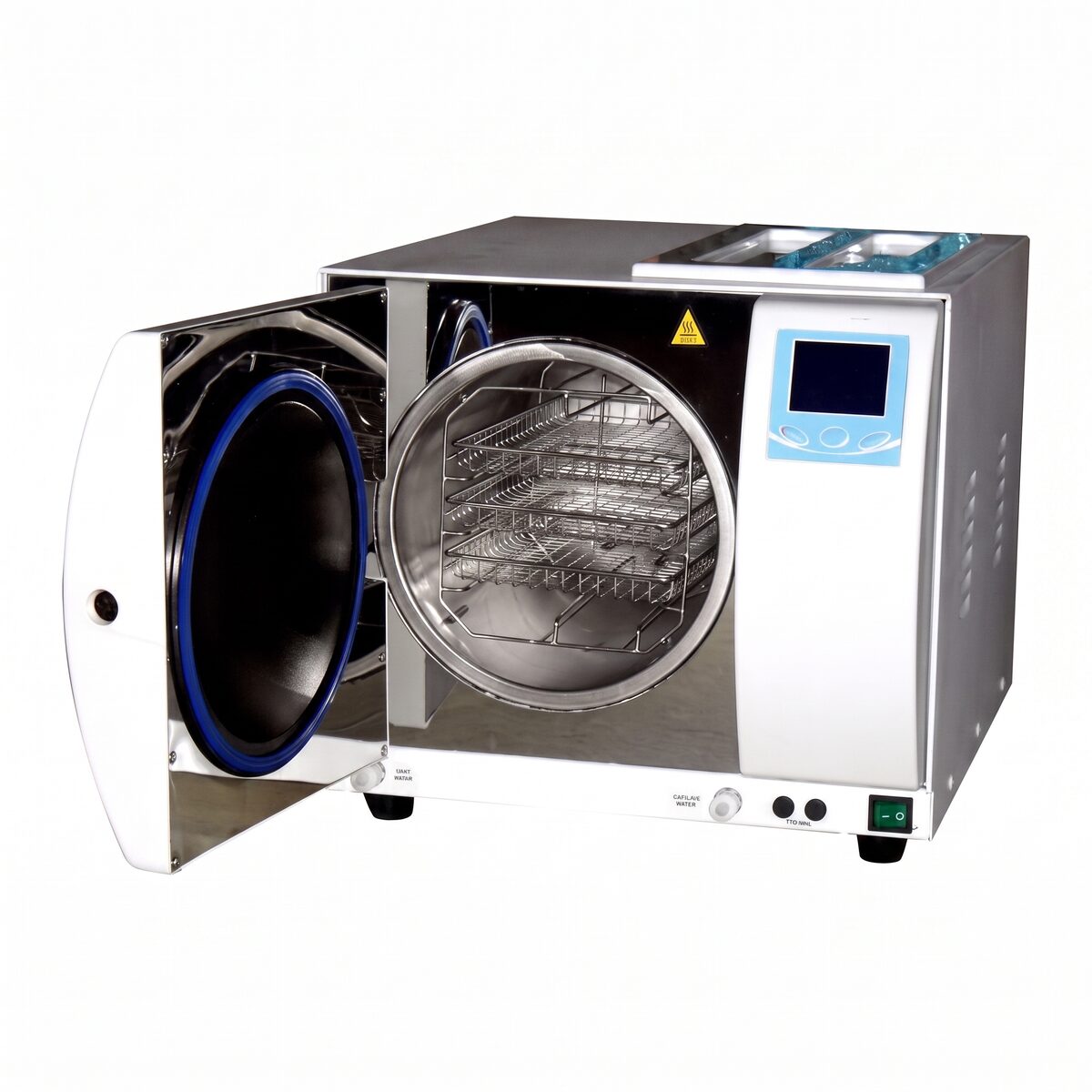 A benchtop autoclave sterilisation unit with its chamber door open, showing the steel chamber and a rack of perforated instrument trays inside.