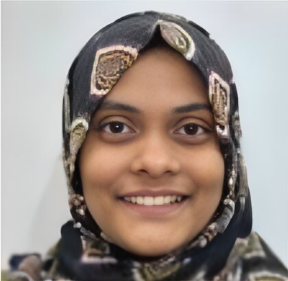 The same young woman smiling after treatment, her front teeth even.